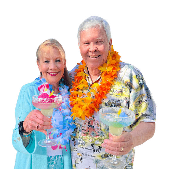 two people enjoying tropical drinks