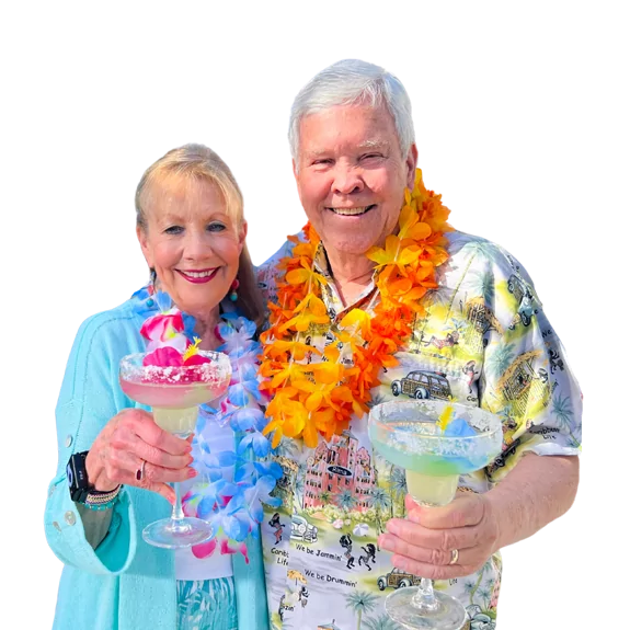 two people enjoying tropical drinks