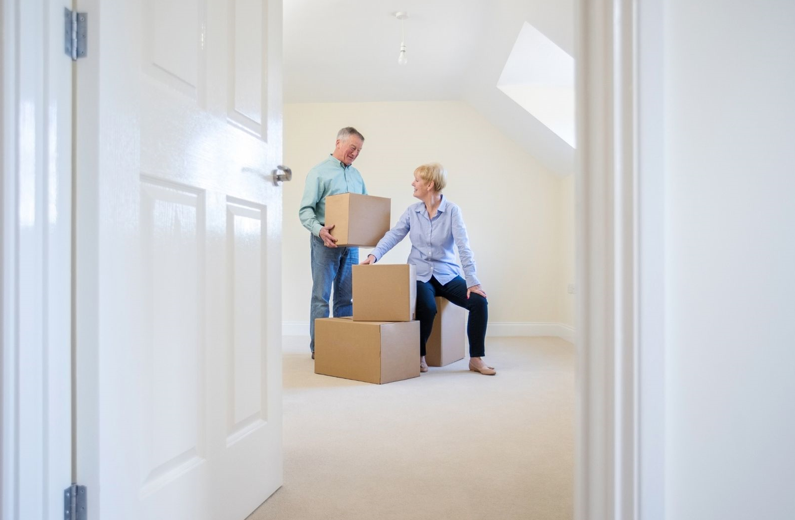 two people moving boxes